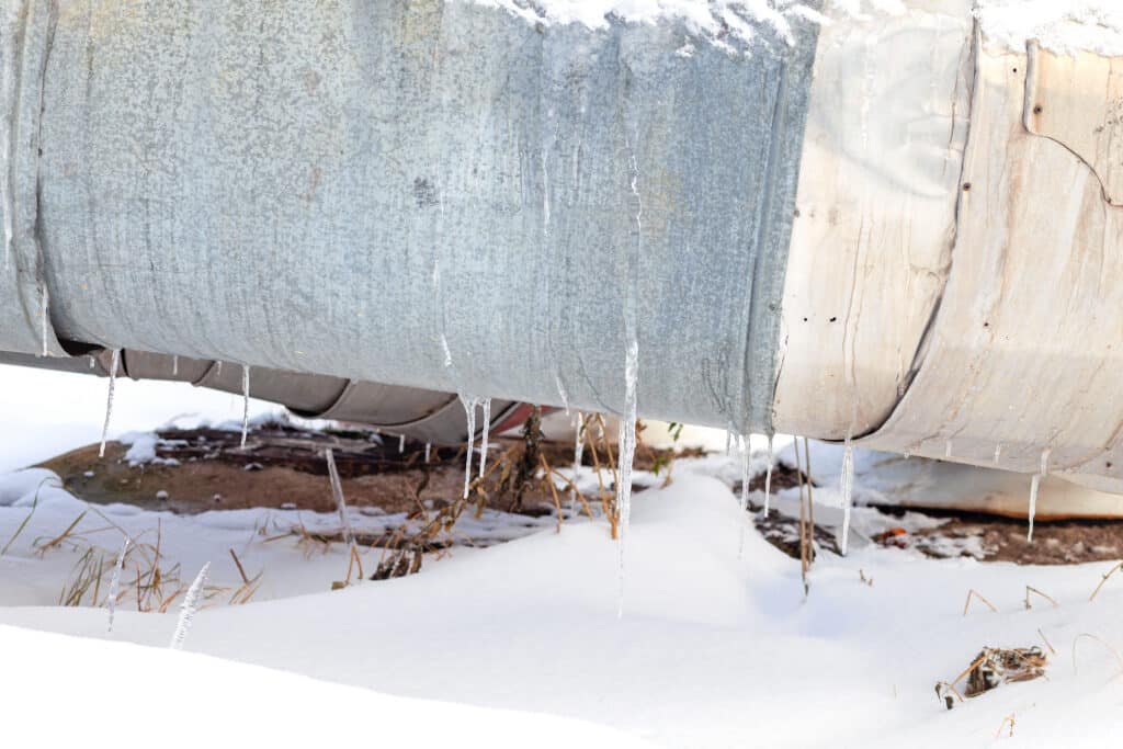 pipe in snow with icicles hanging in houston tx