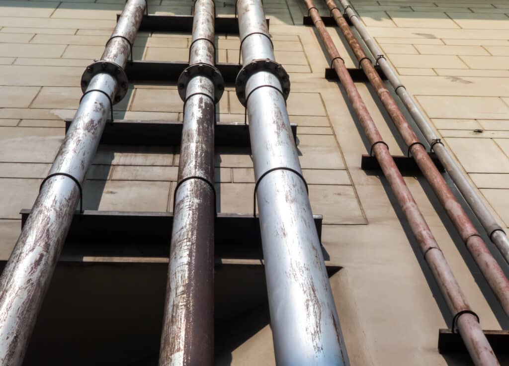 lead pipes on side of wall in houston tx