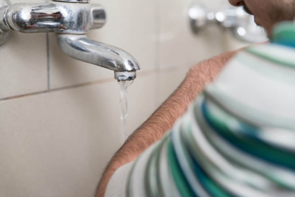 homeowner in houston tx testing low water pressure