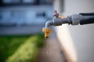 Outdoor faucet dripping water