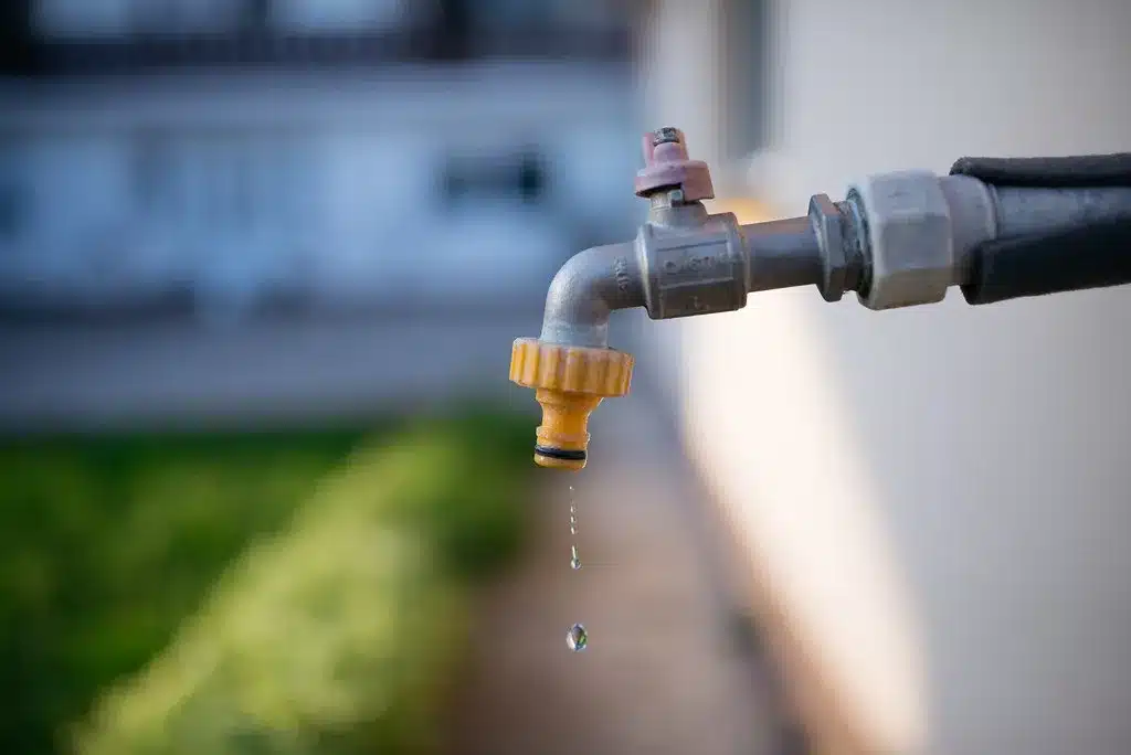 Outdoor faucet dripping water
