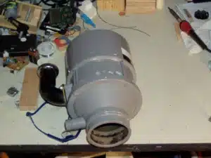 A garbage disposal unit removed from under the sink