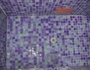 Mosaic tile shower floor around the drain