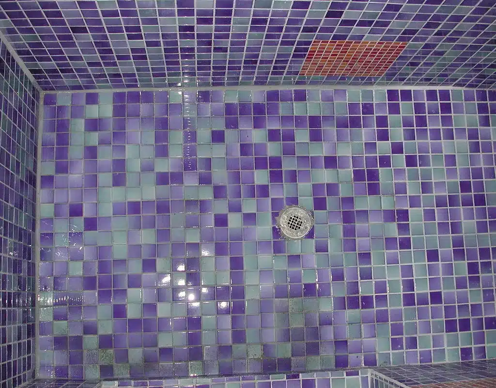 Mosaic tile shower floor around the drain