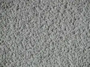 Close-up of popcorn ceiling texture before removal