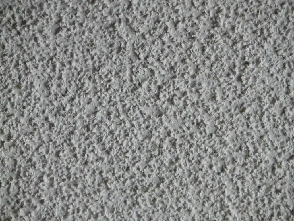 Close-up of popcorn ceiling texture before removal