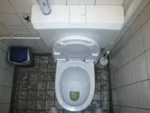 Toilet base on a tile floor