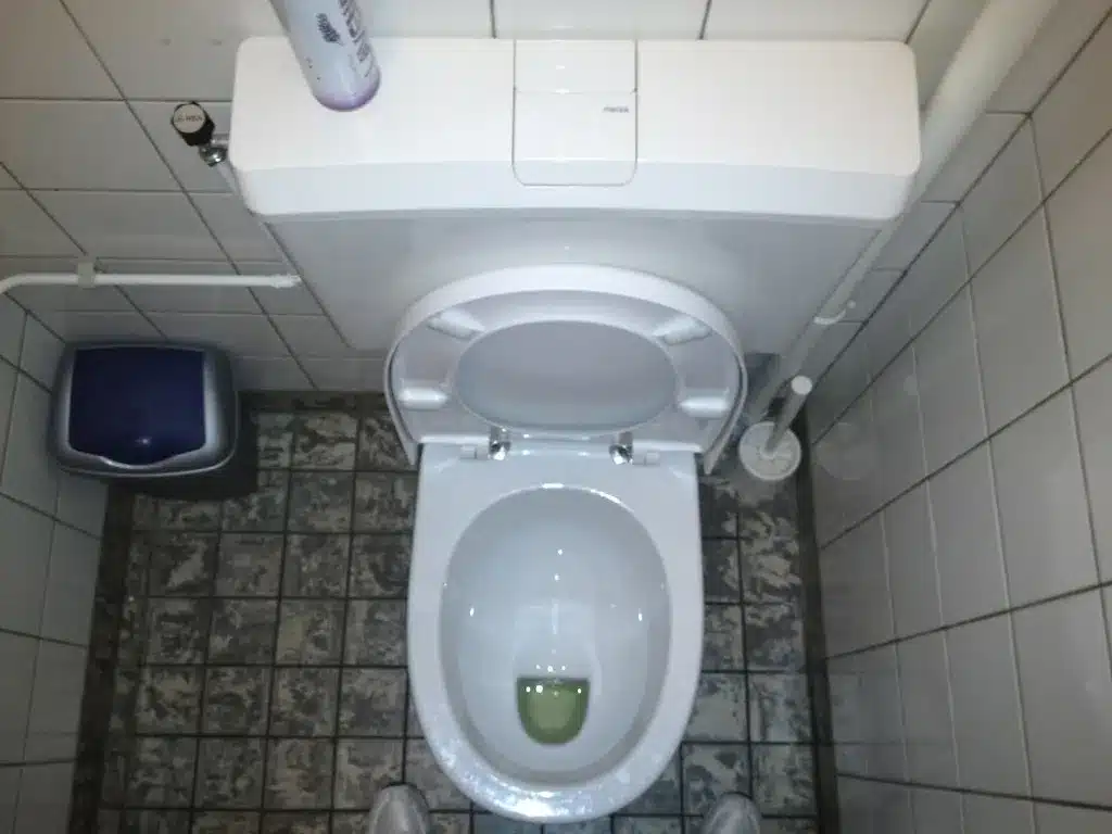 Toilet base on a tile floor
