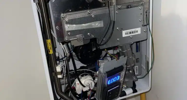 Navien tankless water heater installed on a wall