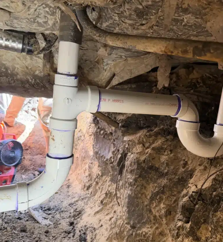 Tunnel under a slab foundation with new pipe lines